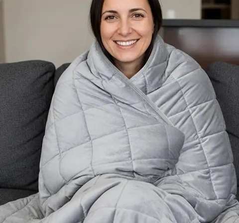 Velin owner wrapped in a weighted blanket