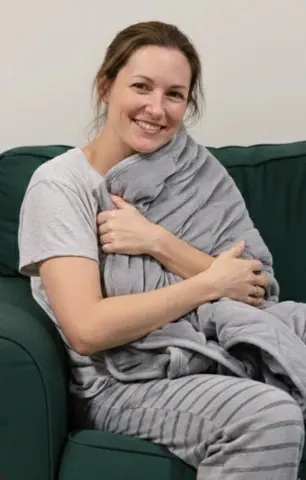 Velin owner wrapped on the sofa